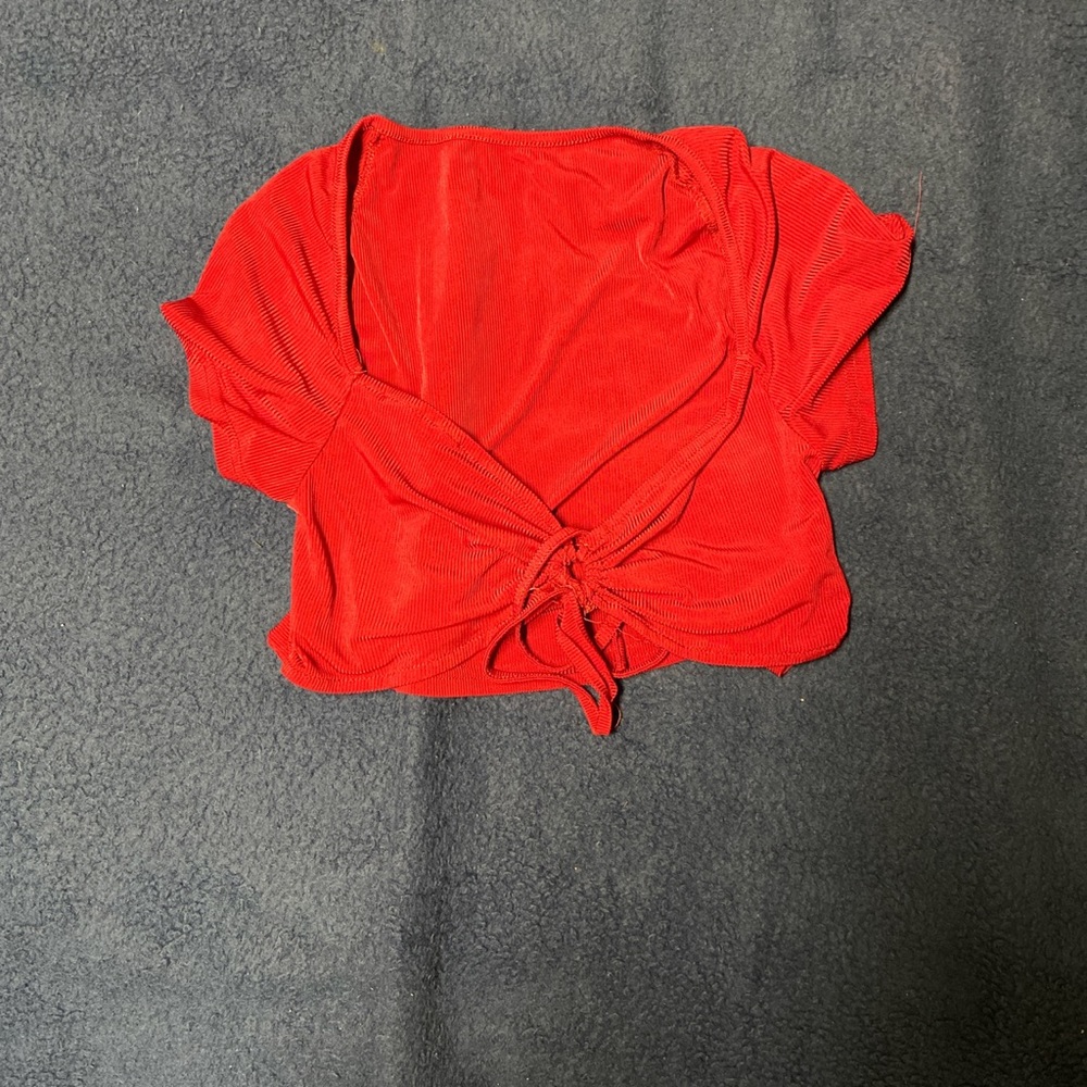 Red short sleeve cropped top tie up front. Size Medium